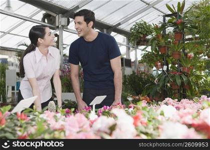 Couple smiling in a garden center