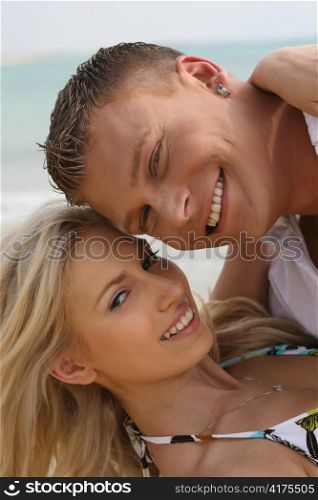 Couple smiling on the beach