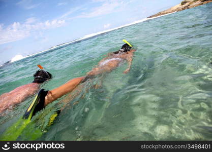 Couple snorkeling in Caribbean waters