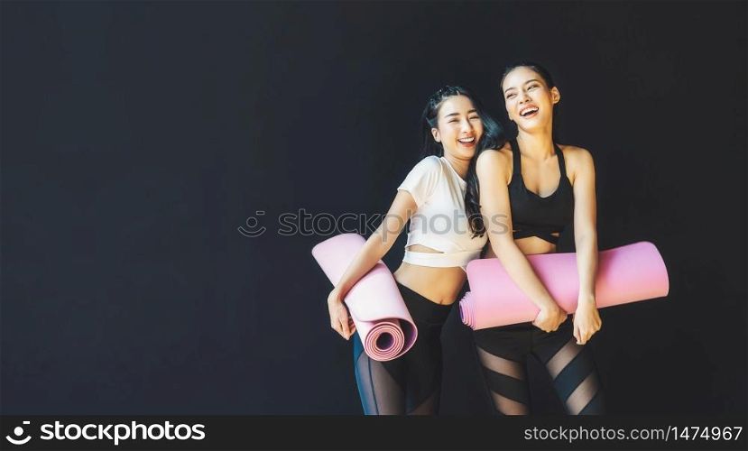 Couple sporty asian woman standing and talking with happiness motion, wearing sportswear bra and pants fashion, posture position, sport club community, sports and healthcare concept