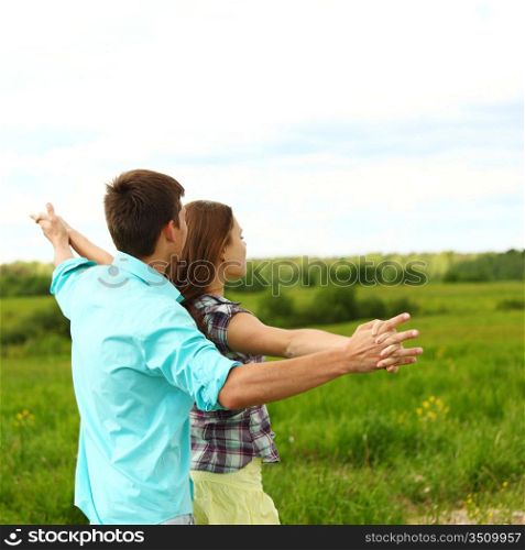 Couple standing in a field