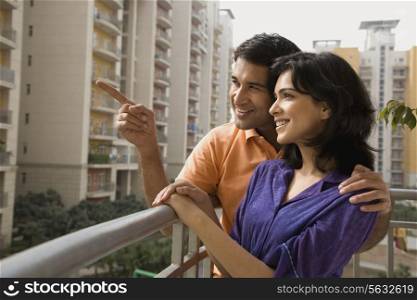 Couple standing on a balcony