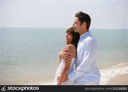 Couple standing on a beach
