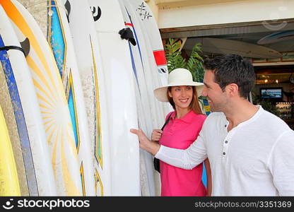 Couple standing on a surfshop