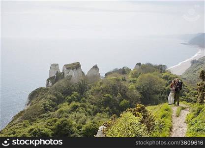 Couple Standing on an Outlook Above the Water