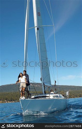 Couple Standing on Bow of Sailboat