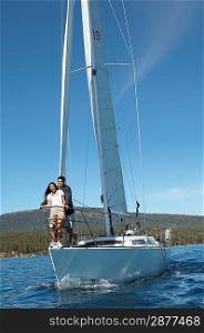 Couple Standing on Bow of Sailboat