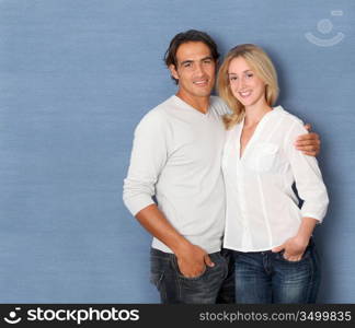 Couple standing on grey background