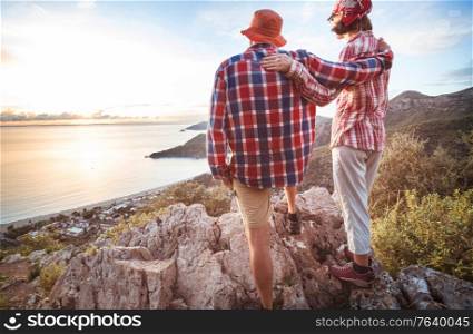 Couple standing on top of a Turkey sea coast