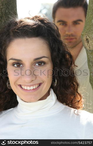 Couple stood amongst trees