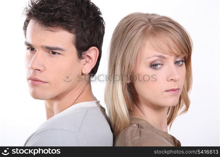 Couple stood back to back following argument