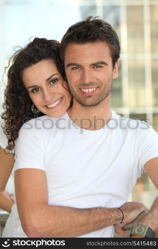 Couple stood by railing