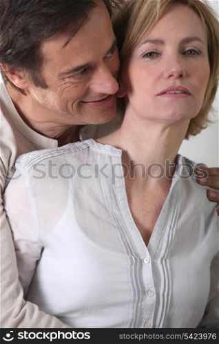 Couple stood holding each other