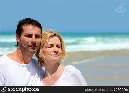 Couple stood on a beach