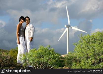 Couple stood on wind farm