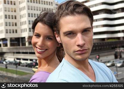 Couple stood outside of high-rise building