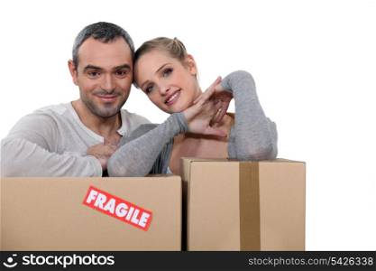 Couple stood with storage boxes