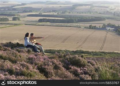 Couple Stopping For Lunch On Countryside Walk