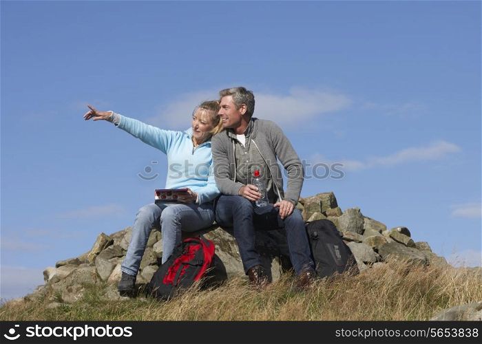 Couple Stopping For Lunch On Countryside Walk
