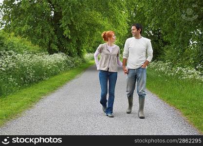 Couple Strolling on Rural Road