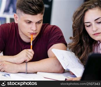 couple studying with book together