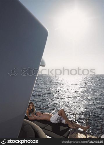 Couple Sunbathing on Boat