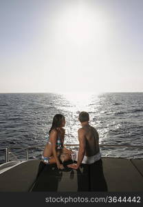 Couple Sunbathing on Boat