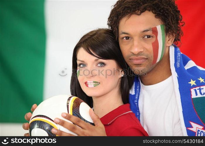 Couple supporting the Italian football team