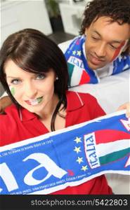 Couple supporting the Italian soccer team