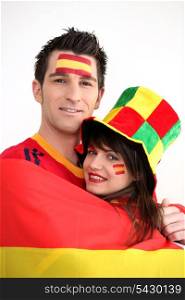 Couple supporting the Spanish football team