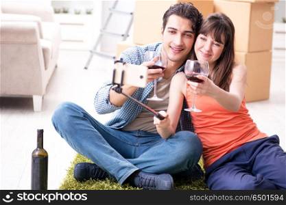 Couple taking selfie and drinking wine