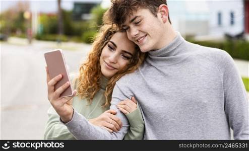 couple taking selfie outdoors close up