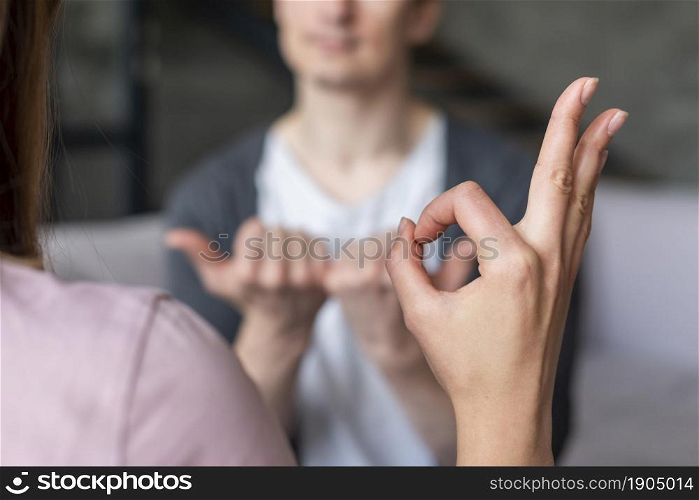 couple talking using sign language. Beautiful photo. couple talking using sign language