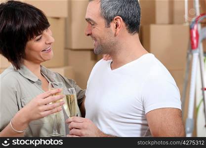 Couple toasting during moving