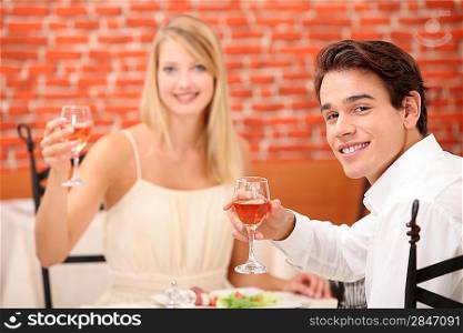 Couple toasting with pink wine