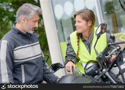 couple trying a new motorbike