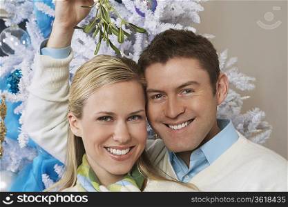 Couple under mistletoe, portrait