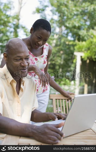 Couple using a laptop