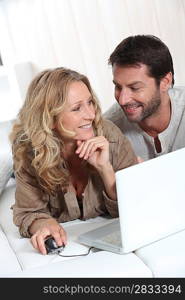 Couple using a laptop