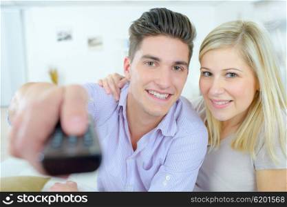 Couple using a remote control