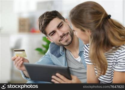 couple using card for online purchase