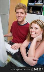 Couple Using Desktop Computer