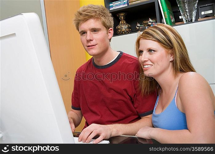 Couple Using Desktop Computer