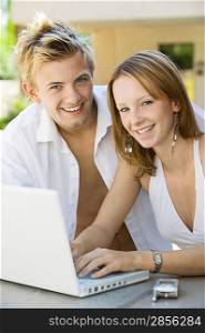 Couple Using Laptop Together