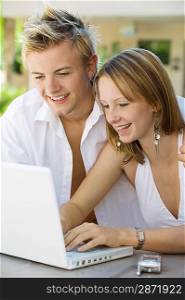 Couple Using Laptop Together
