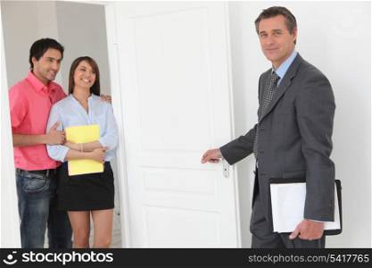 Couple viewing a property with an estate agent