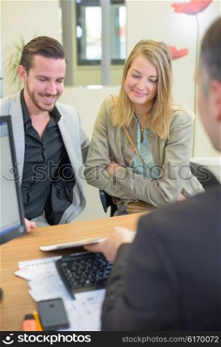 couple visiting an office