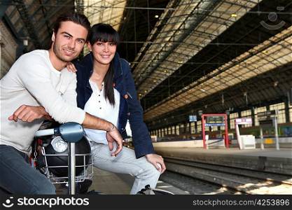 Couple waiting for train