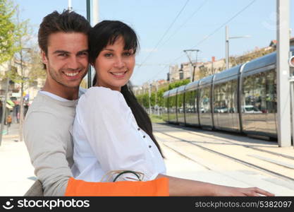 Couple waiting for tram