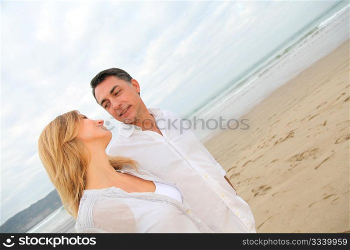 Couple walking by the beach